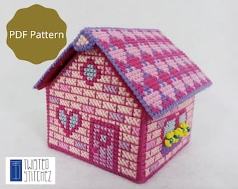 Könnte beinhalten: Ein rosa-violetter, hausförmiger Taschentuchbox-Bezug mit einem karierten Dach und einem Herz-Design auf der Vorderseite. Die Box ist aus Plastik-Canvas gefertigt und mit Perlen verziert. Das Bild enthält den Text "PDF Pattern".