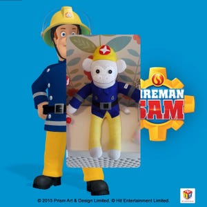 May include: A plush toy monkey dressed as a firefighter. The monkey is wearing a blue and yellow uniform with a red helmet. The monkey is sitting on a white surface with a floral pattern. The text "Fireman Sam" is visible in the background.