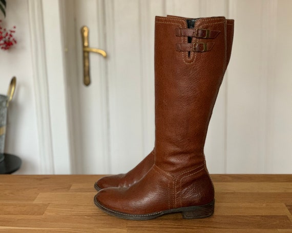 Brown below top the knee boots