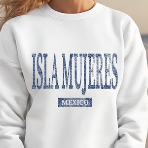 May include: White sweatshirt with a blue graphic print that says "ISLA MUJERES MEXICO".