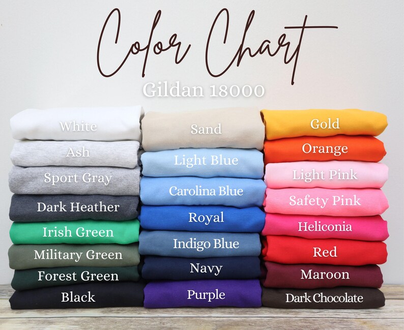 May include: Color chart for Gildan 18000 t-shirts, showing a variety of colors including white, ash, sport gray, dark heather, Irish green, military green, forest green, black, sand, light blue, Carolina blue, royal, indigo blue, navy, purple, gold, orange, light pink, safety pink, heliconia, red, maroon, and dark chocolate.