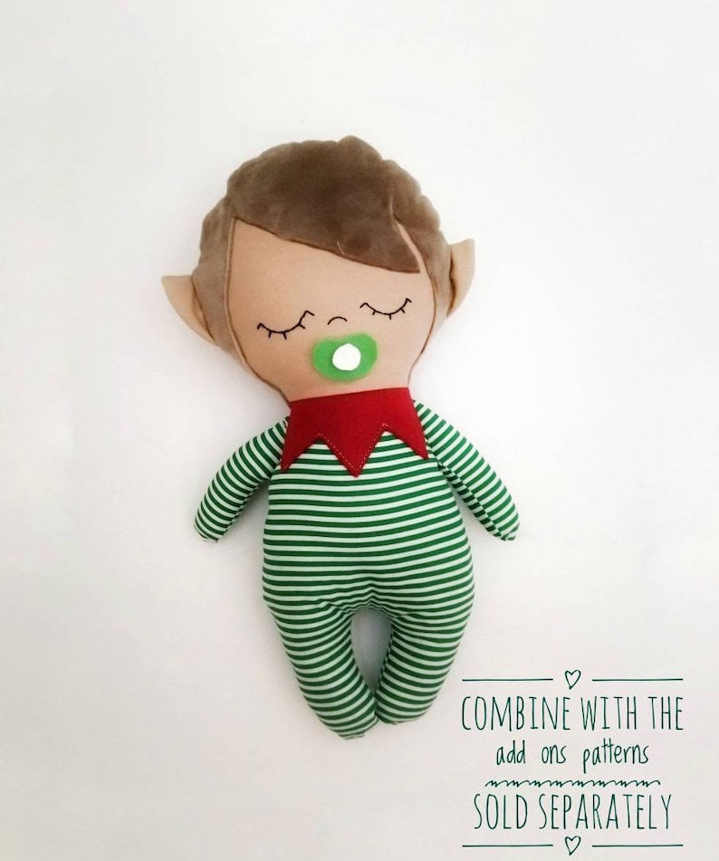 May include: A plush elf doll with brown hair, closed eyes, and a green pacifier. The elf is wearing a green and white striped outfit with a red collar. The text "COMBINE WITH THE add ons patterns SOLD SEPARATELY" is at the bottom of the image.