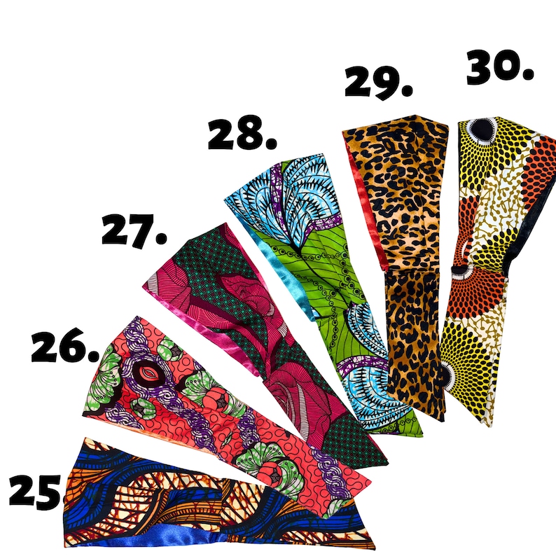 Pode incluir: Um conjunto de 6 faixas de cabe&ccedil;a coloridas com diferentes padr&otilde;es de impress&atilde;o africana. As faixas de cabe&ccedil;a est&atilde;o dispostas em forma de leque, com os n&uacute;meros de 25 a 30 impressos no fundo branco.