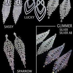May include: Assortment of silver crystal dangle earrings.  The earrings are named "Sassy", "Lucky", "Sparrow", and "Glimmer Silver Silver AB".