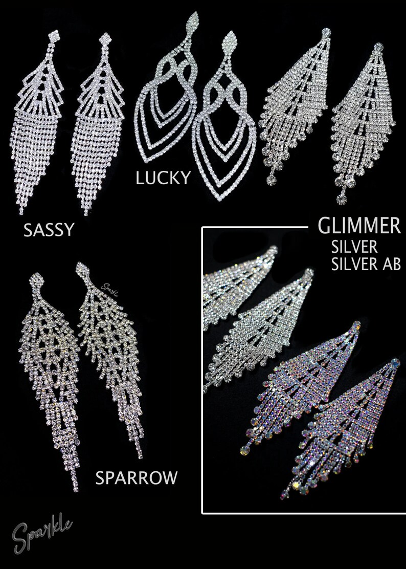 May include: Assortment of silver crystal dangle earrings.  The earrings are named "Sassy", "Lucky", "Sparrow", and "Glimmer Silver Silver AB".