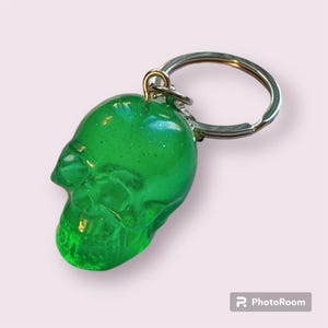Small sized green  resin skull keychain with glitter