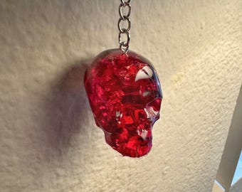 medium sized crimson resin skull keychainr with silver foil