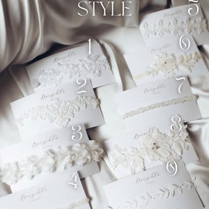 May include: Nine different styles of white lace garters with the word 'Boryekle' printed on each card. The garters are arranged in a grid pattern on a white surface. CHOOSE YOUR STYLE is printed at the top of the image.