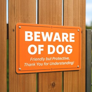 Beware of Dog metal sign on wooden fence, friendly but protective dog warning sign, durable outdoor aluminum home security decor.