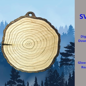 May include: A wood-grain patterned SVG file for a tree ring ornament. The file is ready to be used with a Glowforge.