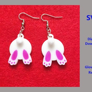 May include: A pair of white bunny butt earrings with pink ears and white pom-poms. The earrings are on a red background. SVG Digital Download Glowforge Ready.