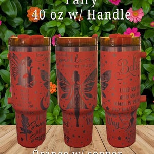 May include: Three orange 40 oz tumblers with copper lids and handles. Each tumbler features a fairy design and inspirational quotes. The text on the tumblers includes "Fairy", "leave a little sparkle", and "Believe".