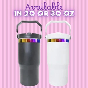 May include: Two insulated tumblers, one black and one white, each with a handle and a rainbow-colored band. The text "Available IN 20 OR 30 OZ" is displayed above the tumblers. The background is pink with vertical stripes.