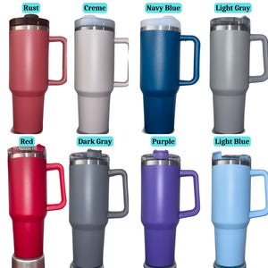 May include: Eight insulated travel mugs in various colors, including rust, creme, navy blue, light gray, red, dark gray, purple, and light blue. Each mug has a handle, a lid, and a stainless steel body.