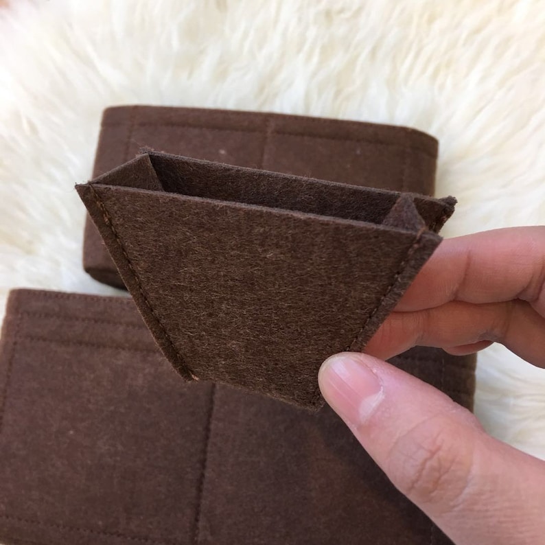 May include: Brown felt organiser insert with multiple compartments for a handbag or purse.