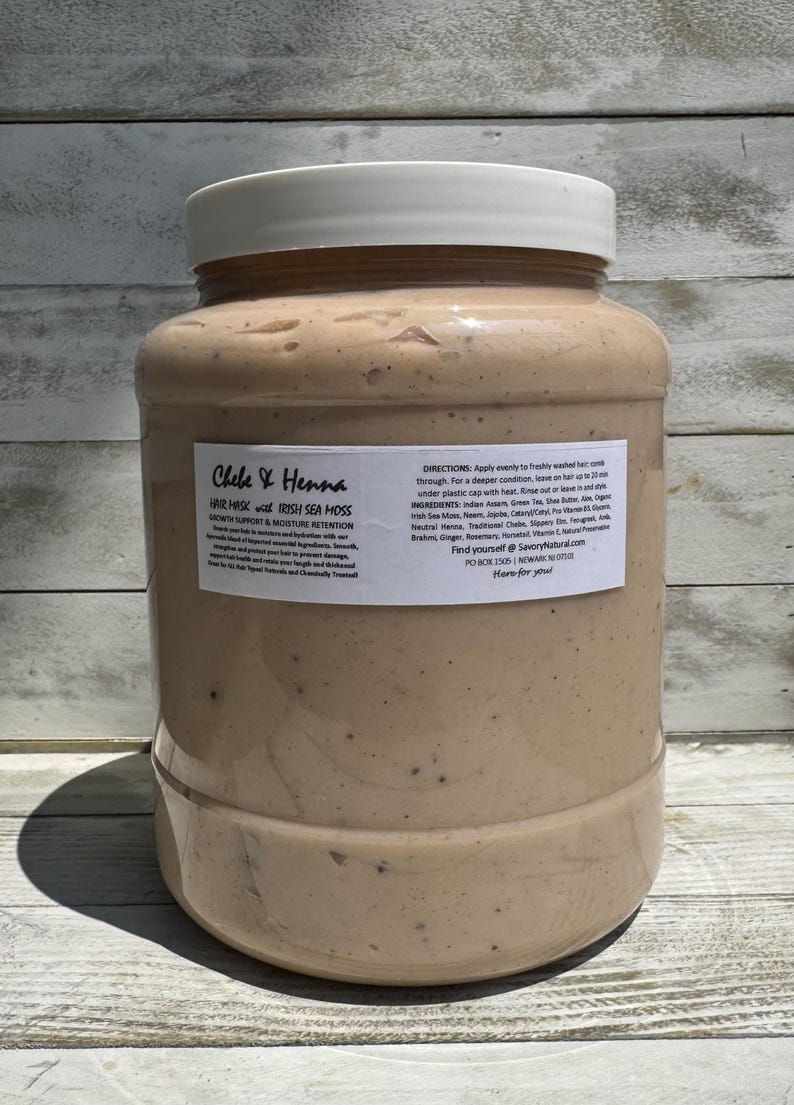 May include: A large, clear plastic jar filled with a beige, speckled hair mask. The white label reads Chebe & Henna Hair Mask with Irish Sea Moss, Growth Support & Moisture Retention, along with directions, ingredients, and contact information.