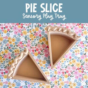 May include: Two tan, triangular pie slice sensory play trays with wavy, crust-like edges. The text PIE SLICE Sensory Play Tray is displayed in white at the top of the image against a blue background.