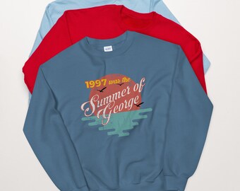 What it Mean George Costanzas Frogger Record Shattered Crewneck Pullover Sweatshirt 8 oz. What it Mean George Costanzas Frogger Record Shattered Crewneck Pullover Sweatshirt 8 oz.