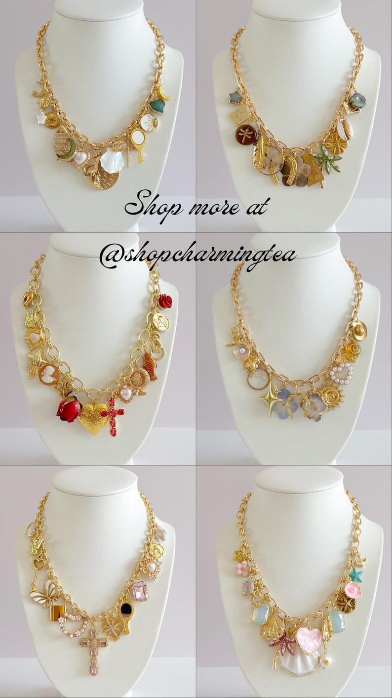 Peut inclure: Six colliers dor&eacute;s &agrave; breloques sur des bustes blancs. Chaque collier pr&eacute;sente divers charms, dont des coquillages, des croix, des c&oelig;urs et des &eacute;toiles. Le texte "Shop more at @shopcharmingtea" est visible.