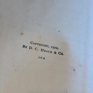 May include: Close-up of a vintage book page with the text "COPYRIGHT, 1911, BY D. C. HEATH & CO." printed in black ink. The page is off-white with small brown spots, suggesting age. The text is centered and in a classic serif font.