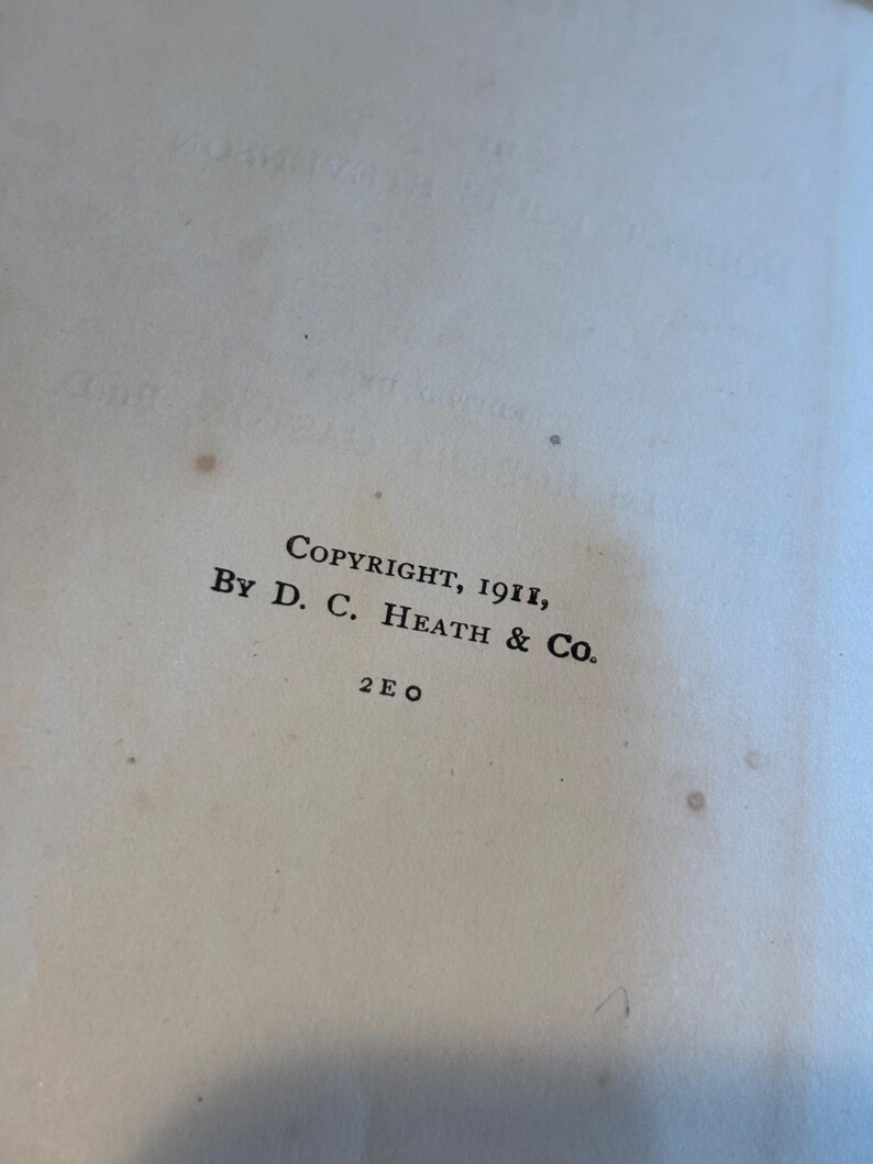 May include: Close-up of a vintage book page with the text "COPYRIGHT, 1911, BY D. C. HEATH & CO." printed in black ink. The page is off-white with small brown spots, suggesting age. The text is centered and in a classic serif font.
