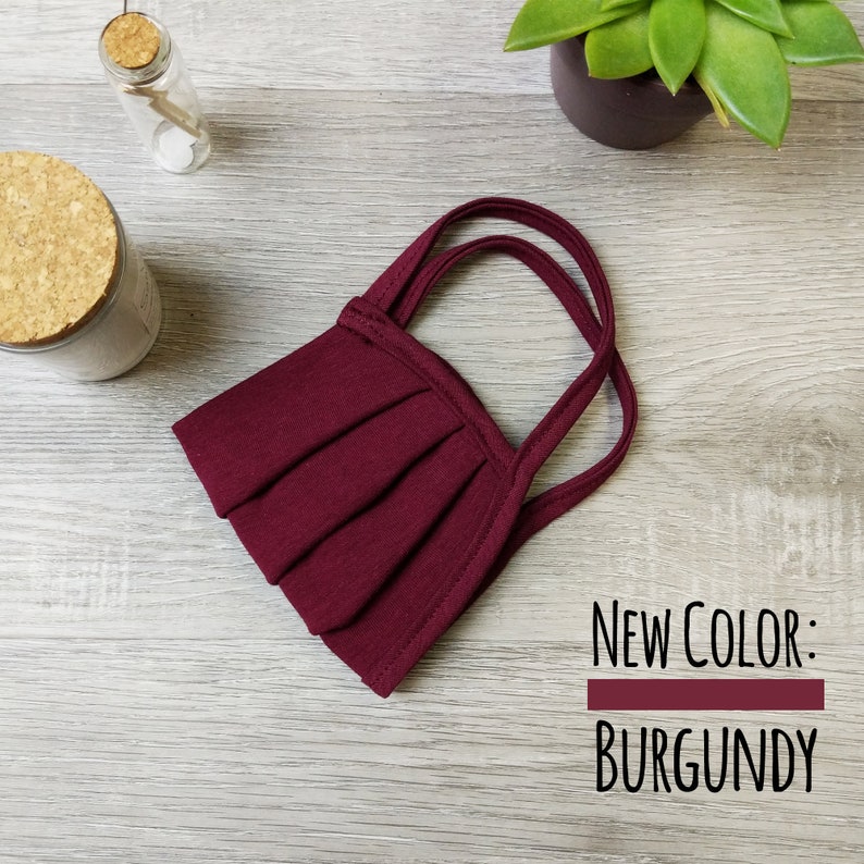 May include: Burgundy face mask with pleats and adjustable straps. New color: Burgundy.