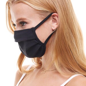 May include: A black face mask with adjustable ear loops. The mask is made of a soft, breathable fabric and is designed to provide a comfortable fit.
