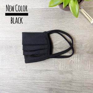 May include: Black face mask with adjustable ear loops.  NEW COLOR BLACK.