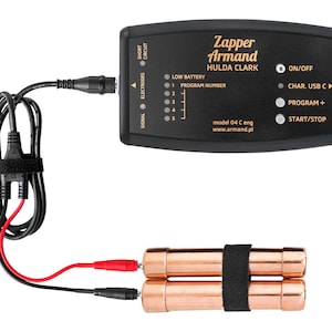 May include: A black Zapper Armand Hulda Clark electronic device with a control panel featuring text, indicator lights, and buttons. It is connected by a black cable to two cylindrical copper electrodes held together by a black strap.