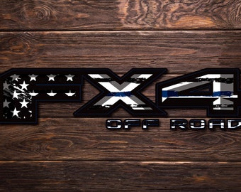 May include: Black and white "FX4 OFF ROAD" decal with a thin blue line and an American flag design.