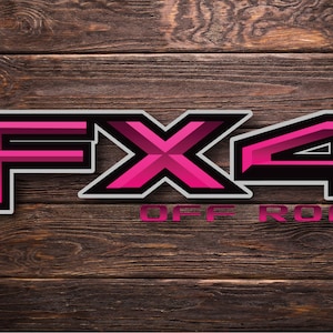 May include: Pink and black "FX4 OFF ROAD" logo with a 3D effect on a wood background.