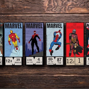 May include: Six colorful comic book covers featuring Marvel characters, including Black Panther, Iron Man, Spider-Man, The Mandalorian, and Daredevil. Each cover has a price and date printed on it.