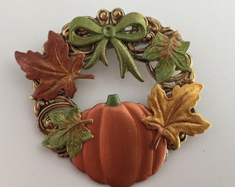 Pumpkin and fall leaf wreath pin. Lightweight, colorful. Hand painted.