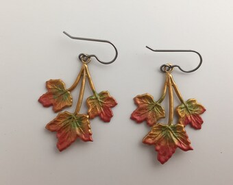 Autumn triple maple earring hand painted in warm Fall colors. Surgical stainless steel wires.