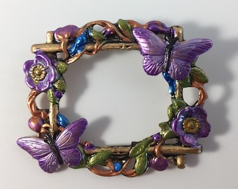 Violet butterflies on Trellis with flowers. Pin, brooch.