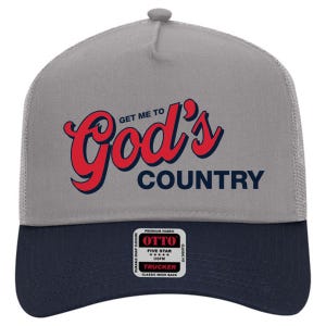 May include: Gray and navy blue trucker hat with the text "Get Me To God's Country" in red script. The hat features a mesh back and a snap closure. The brand name "OTTO" is visible on a small tag.