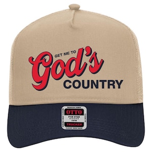 May include: A tan and navy blue trucker hat with the text "GET ME TO God's COUNTRY" in red and black. The hat features a mesh back and a snap closure. The front panel has a patch that says "OTTO".