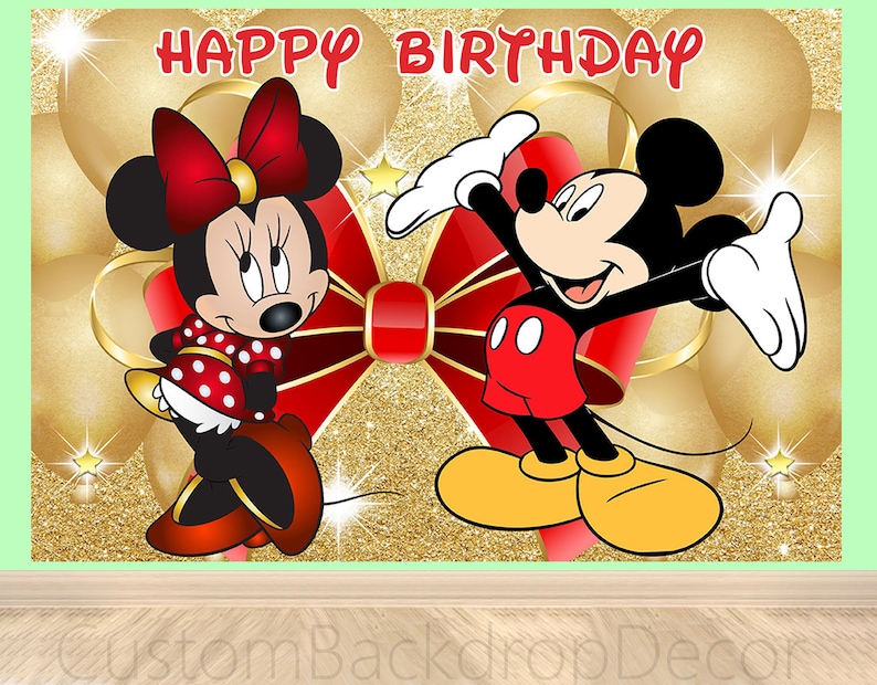 May include: A red and gold birthday backdrop featuring Mickey Mouse and Minnie Mouse. The backdrop has a glittery gold background with red bows and balloons.