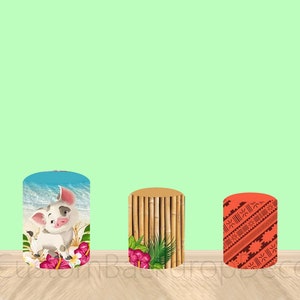 May include: Three cylindrical party decorations with different designs. The first is a light blue cylinder with a cartoon pig and flowers. The second is a brown cylinder with a bamboo pattern and green leaves. The third is a red cylinder with a geometric pattern.