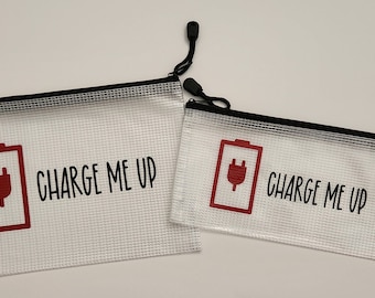 May include: Two clear mesh zippered pouches with black zippers and red battery icons with a black plug. The text "CHARGE ME UP" is printed on both pouches.