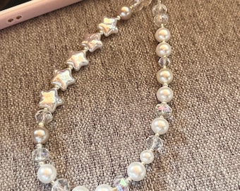 Correa para teléfono con estrellas y perlas
