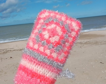 Exfoliating pink washcloth crocheted from polyester yarn