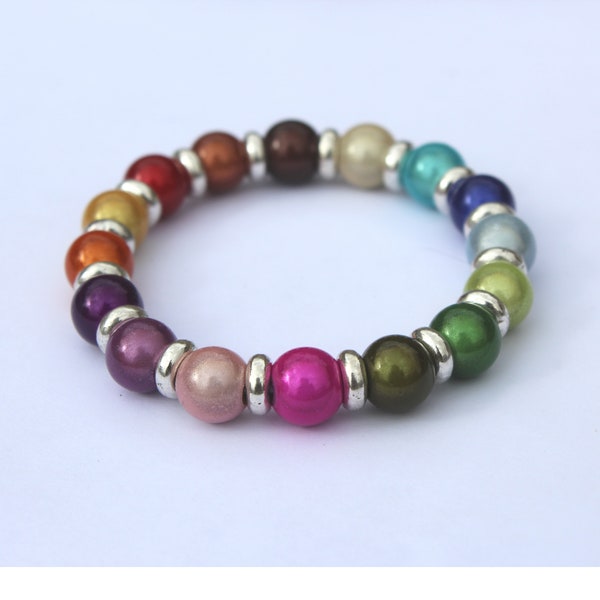 Bracelet enfant multicolore perles magiques et rondelles en métal argenté ,montés sur élastique Arc en Ciel