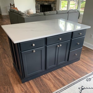 Kitchen island with shop stools and storage