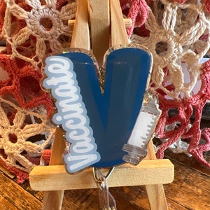 Vaccinate badge reel