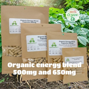 May include: Four brown paper bags with white labels containing organic energy blend capsules in 500mg and 650mg sizes. The bags are labeled with the brand name "Kimball Botanicals" and the text "100% Organic".
