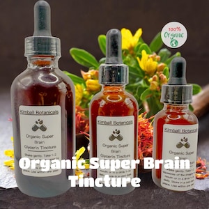 May include: Three glass bottles of Kimball Botanicals Organic Super Brain Glycerin Tincture with black droppers. The bottles are filled with a reddish-brown liquid. The labels read "100% Organic". Yellow flowers are in the background.