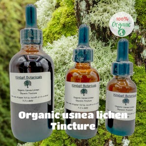 May include: Three brown glass bottles of organic usnea lichen glycerin tincture with blue droppers. Each bottle has a white label with the Kimball Botanicals logo and text. The text "Organic usnea lichen Tincture" is displayed at the bottom.
