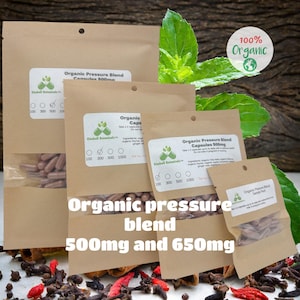 May include: Several brown paper pouches of organic pressure blend capsules, 500mg and 650mg, are displayed. The pouches have clear windows showing the capsules. The image includes a "100% Organic" label and green leaves.
