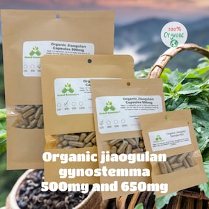 May include: Several brown paper pouches filled with capsules, labeled "Organic Jiaogulan Capsules 500mg" and "Organic Jiaogulan Sample Pack." The text "Organic jiaogulan gynostemma 500mg and 650mg" is also visible. A "100% Organic" logo is in the background.